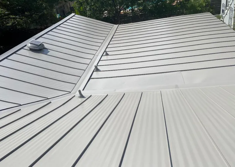 Solar attic fan installed on a metal roof for Roof Ventilation in Red Chute
